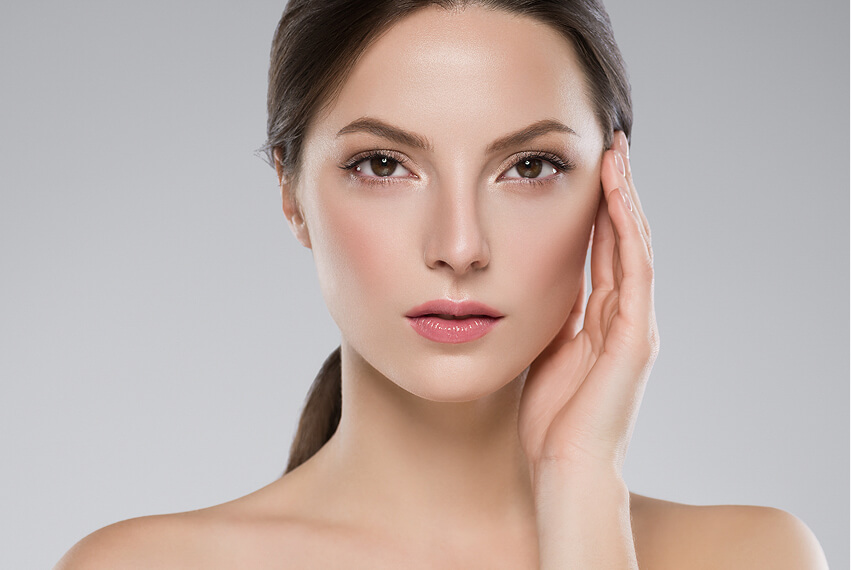 woman touching skin face