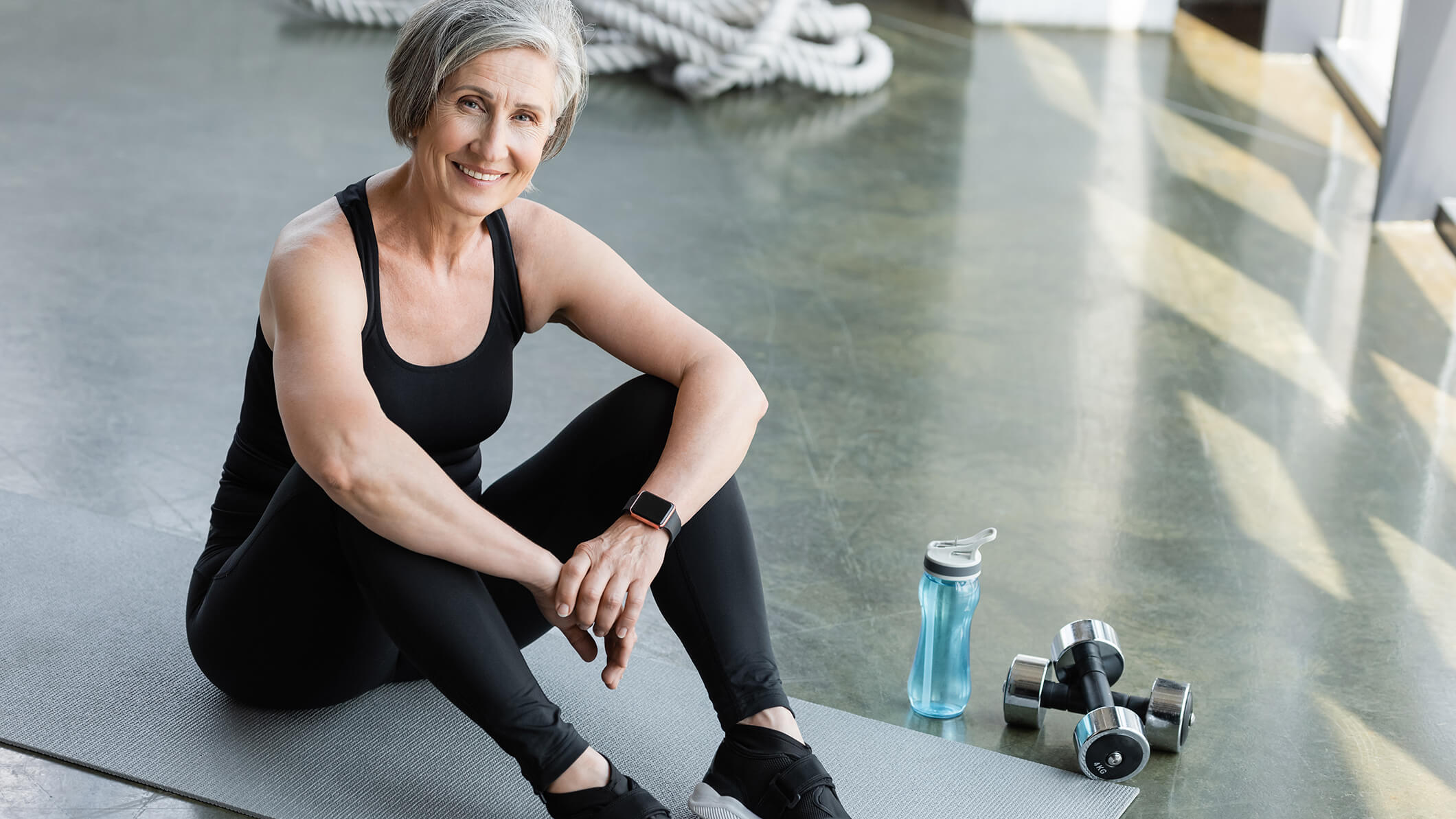 cheerful-senior-woman-in-black-leggings-and-tank-t-2025-06-02-04-28-09-utc (1)
